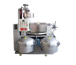 High-capacity screw oil press processing peanuts and sesame.