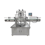 Automatic four head vacuum perfume filling machine for glass bottles with precise liquid level control.