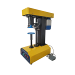 Semi automatic can sealing machine sealing metal and plastic cans in a food packaging production line.