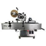 Tabletop horizontal labelling machine for small cylindrical bottles and vials with precise automatic label application.